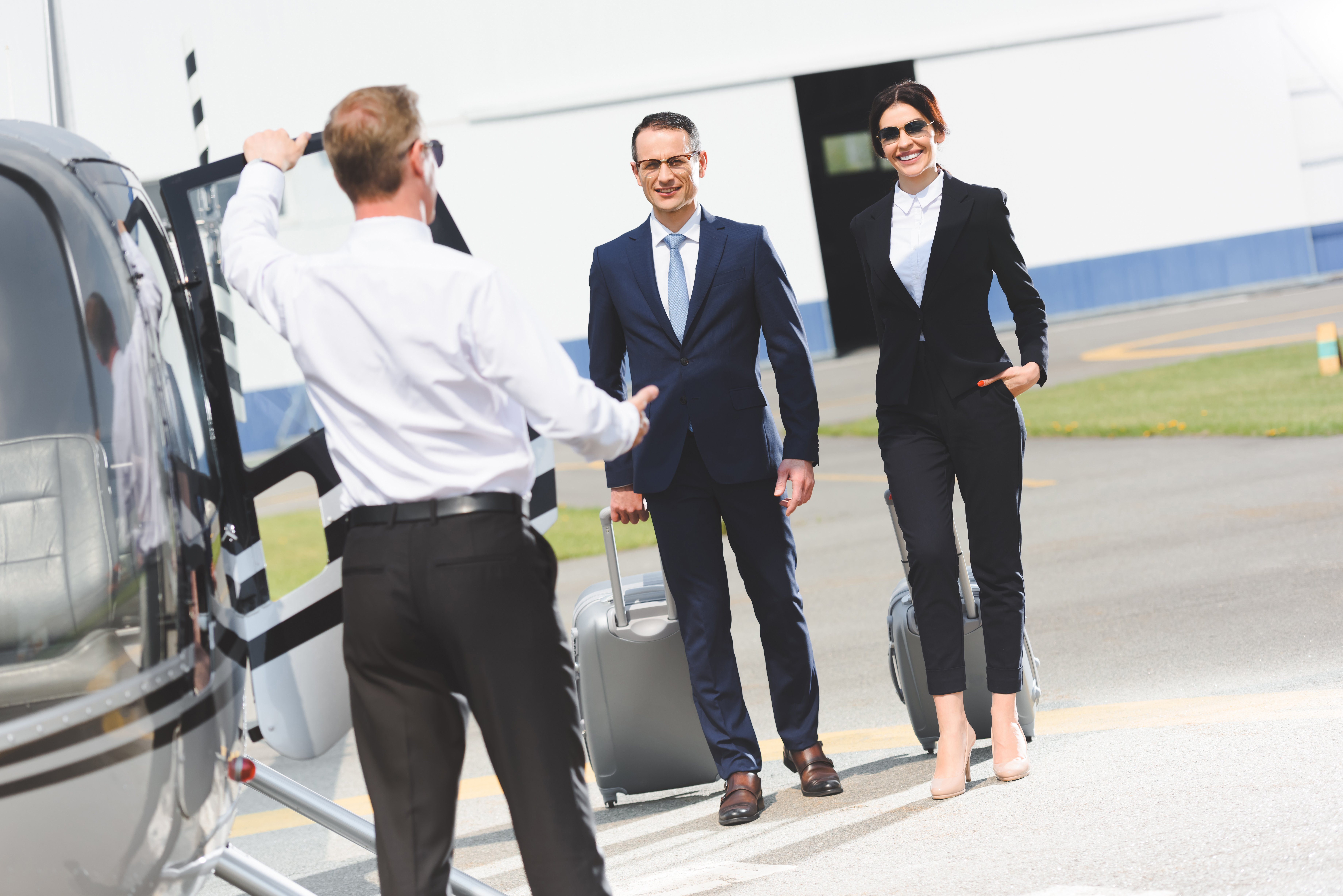 executives getting on a heliopter