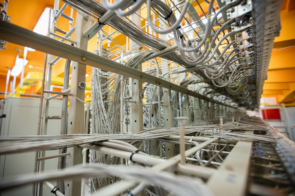 Close-up of cables and wires in server locker in server room